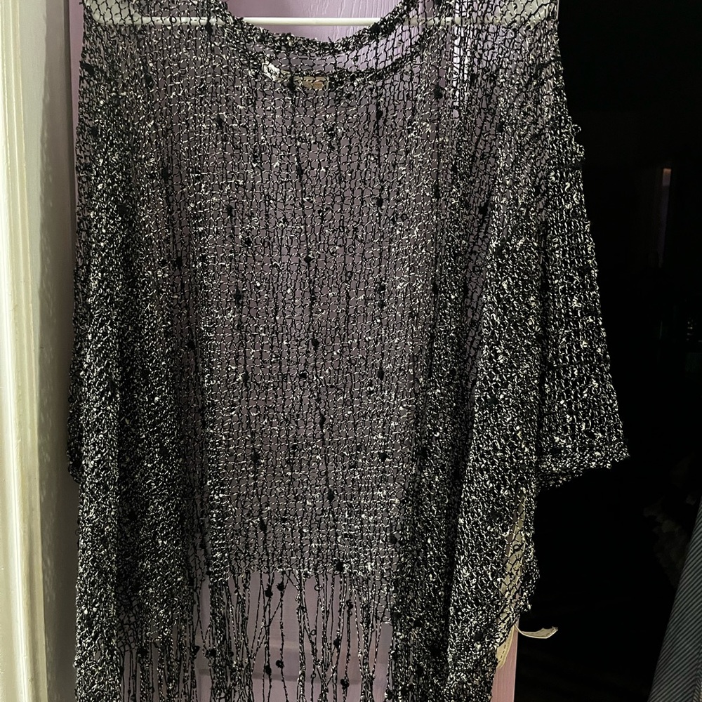 Wear over a cami.  Super cute top